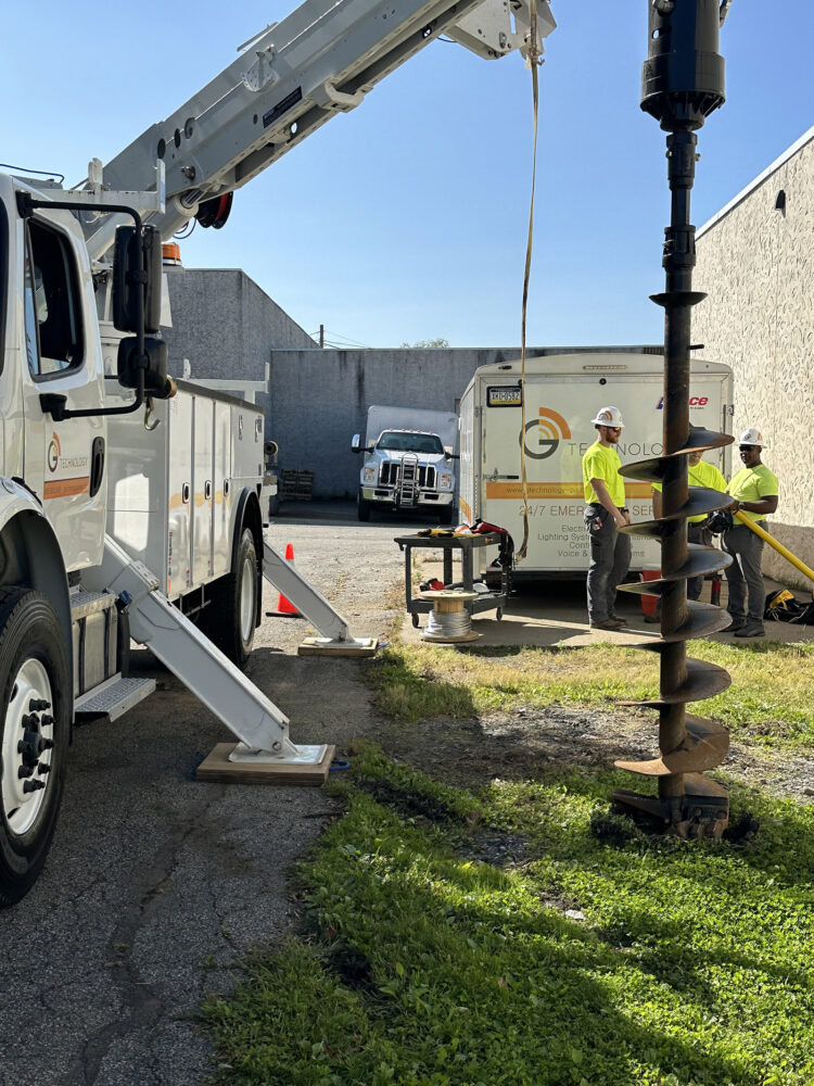 Digger Derrick augering holes